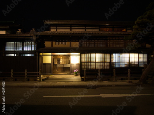 Obraz na plátně Takayama Old Town, JAPAN - April 11, 2014:  Night view of Sannomachi Street in Takayama ,with old wooden buildings and houses dating from the Edo Period