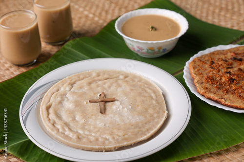 Pesaha Appam, Bread ,Paal religious Christian food on Maundy Thursday, Happy, Good Friday with rice flour Kerala India Sri Lanka. Palm Sunday, Easter Sunday. Top view cross of coconut palm leaf  photo