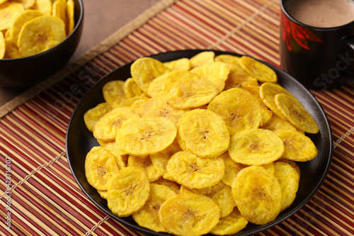 banana chips, popular Kerala snack deep fried in  coconut oil. traditional South Indian tea time snack on banana leaf, Kerala India on Onam, Vishu, Diwali, Ramzan photo