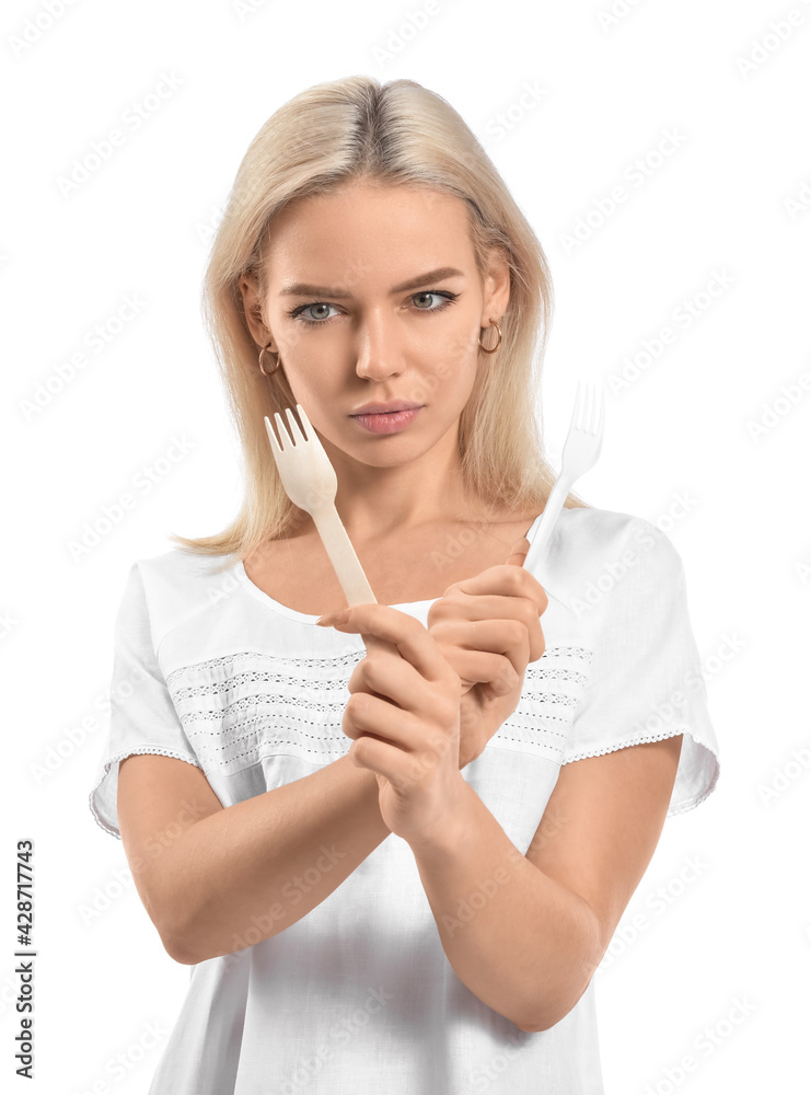 Naklejka premium Beautiful young woman with different forks on white background