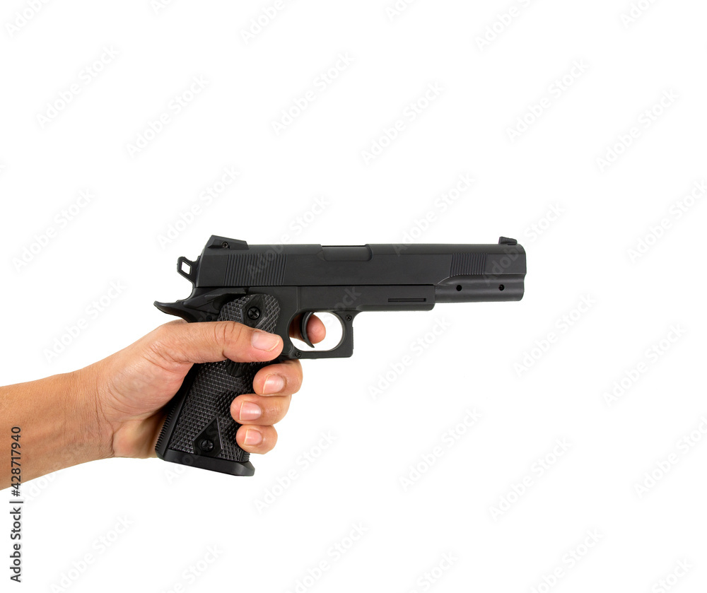 Hand holding gun on white background with clipping path