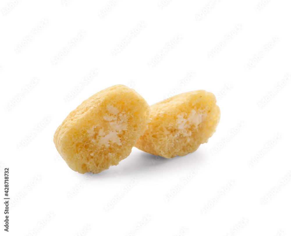 Tasty corn pillows on white background