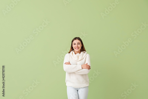 Happy young woman on color ...