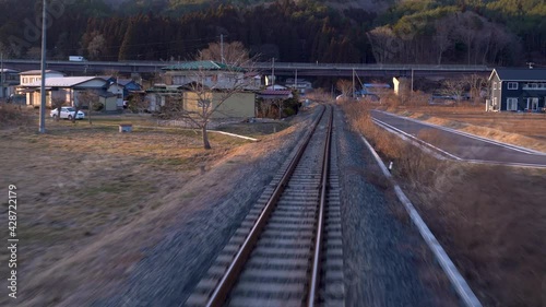Wallpaper Mural View from back of train riding through Japanese countryside with few houses Torontodigital.ca