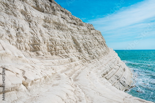 Perspective of a unique white rock formation by the blue green sea. Scala dei Turchi in Agrigento, Sicily 