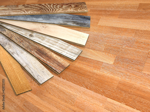 New parquet planks of different colors with different wood species on wooden floor