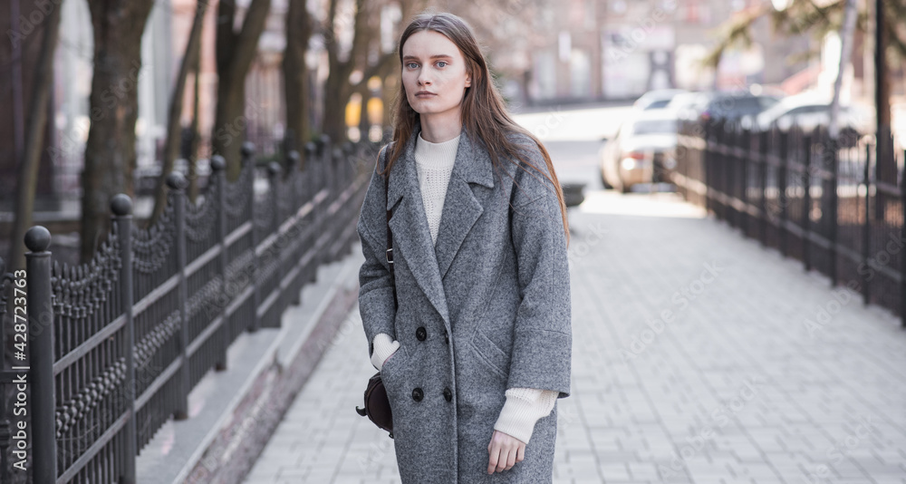 Portrait of an attractive girl on the street while walking Portrait of an attractive girl on the street while walking