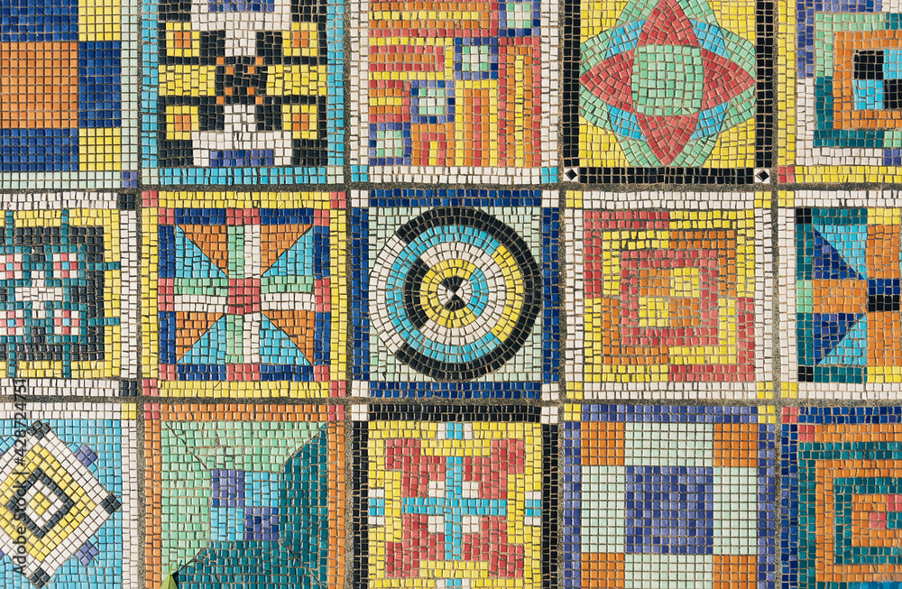 The colorful mosaic pattern on wall surface. Art abstract background