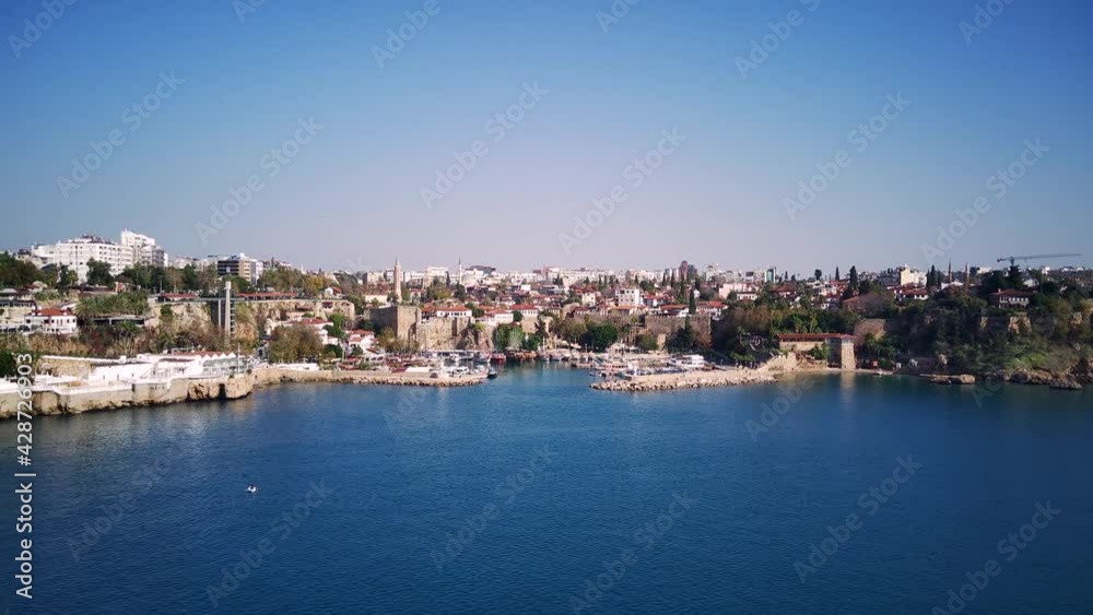 Aerial photograph of Antalya bay in Antalya city from high point of drone fly on sunny day in Turkey. Amazing aerial cityscape view from birds fly altitude on beautiful town and sea full of yahts Aerial photograph of Antalya bay in Antalya city from high point of drone fly on sunny day in Turkey. Amazing aerial cityscape view from birds fly altitude on beautiful town and sea full of yahts