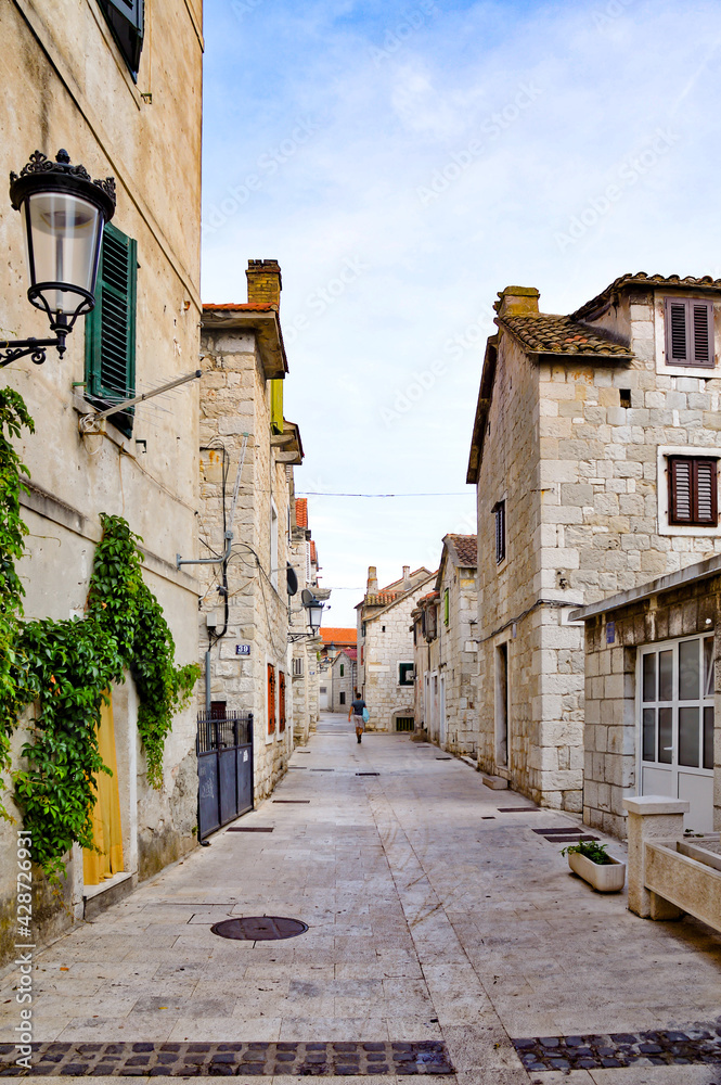 A narrow street in the historic center of Split, an ancient city in Croatia.