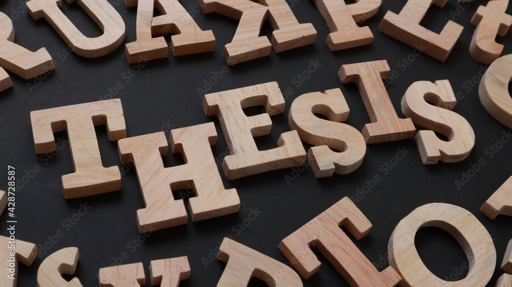 Thesis, text words typography written with wooden letter on black background, life and business motivational inspirational Thesis, text words typography written with wooden letter on black background, life and business motivational inspirational