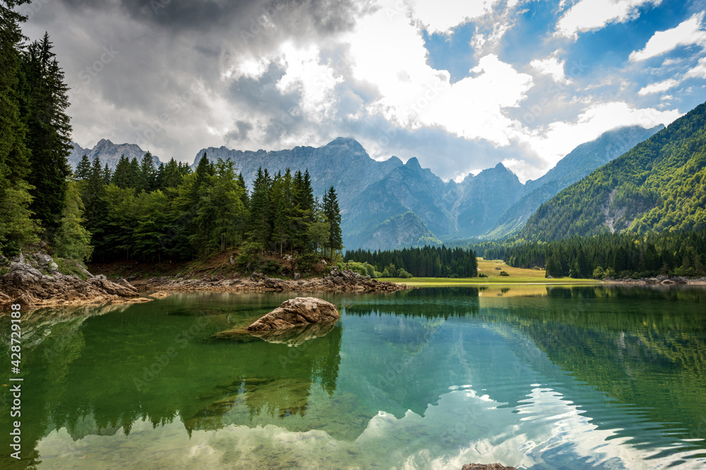 Small Lake of Fusine (Lago Superiore di Fusine) and the Mountain Range of Mount Mangart, Julian Alps, Tarvisio, Udine province, Friuli Venezia Giulia, Italy, Europe.