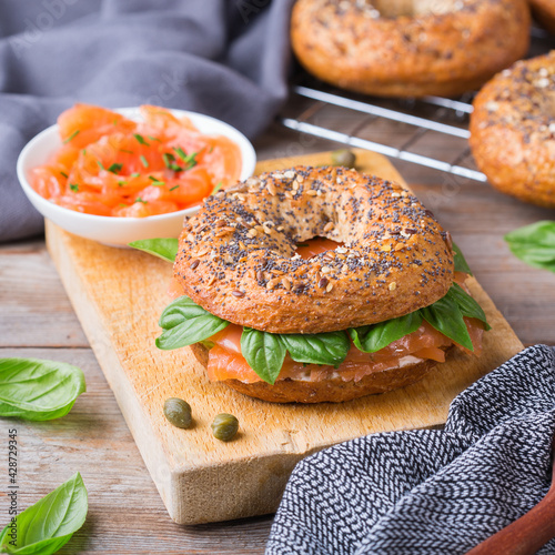 Bagels with cream cheese and salmon. Plating, fast lunch, meal.  photo