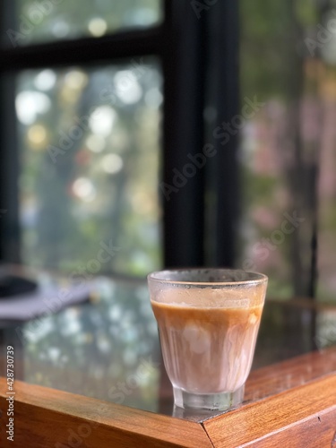 a glass of coffee with mil. Cafe concept