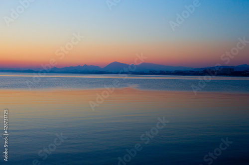 A calm Mediterranean Sea after sunset, Side, Turkey. © tonymills
