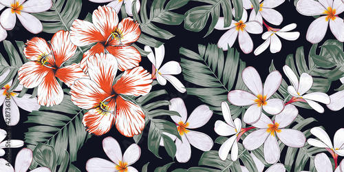 Seamless pattern floral with Hibiscus frangipani flowers and palm leaves abstract background.Vector illustration hand drawn.For fabric fashion print design or product packaging.