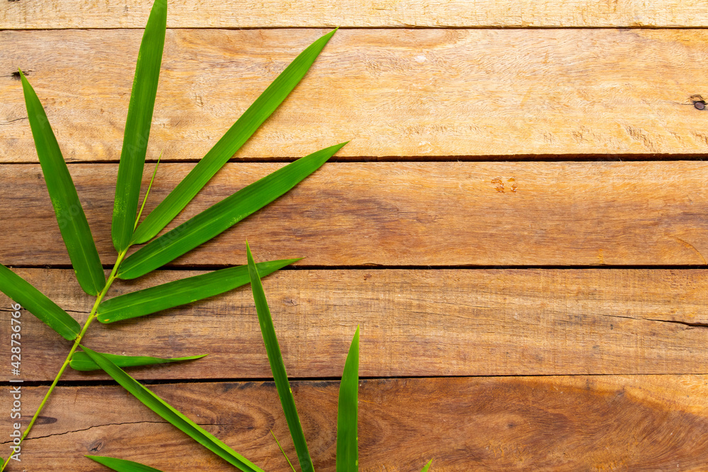 background texture nature bamboo leaf arrangement flat lay postcard style on wooden background texture nature bamboo leaf arrangement flat lay postcard style on wooden