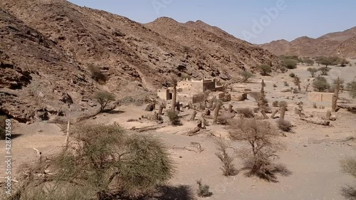 An aerial view of the abandoned traditional Arab family house in Wadi Massal, Saudi Arabia. The drone flying out.