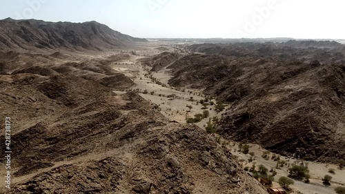 Aerial view from a drone flying over  Wadi Massal, an archeological site in Saudi Arabia photo
