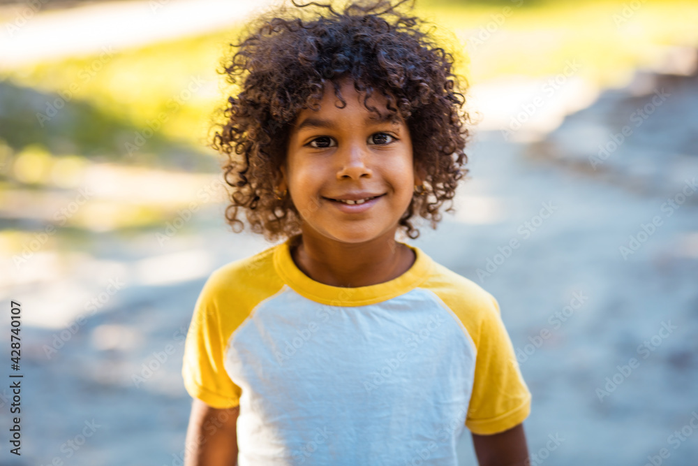 Portrait of smiling African American little girl outside. Portrait of smiling African American little girl outside.