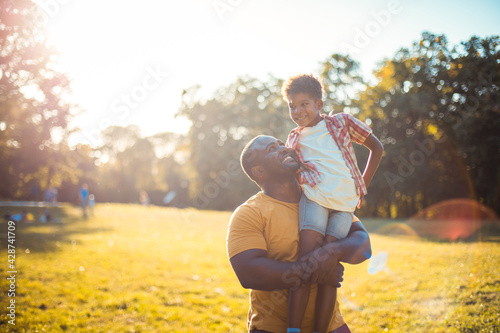 Obraz na plátne Father son day. African American father and son in nature.
