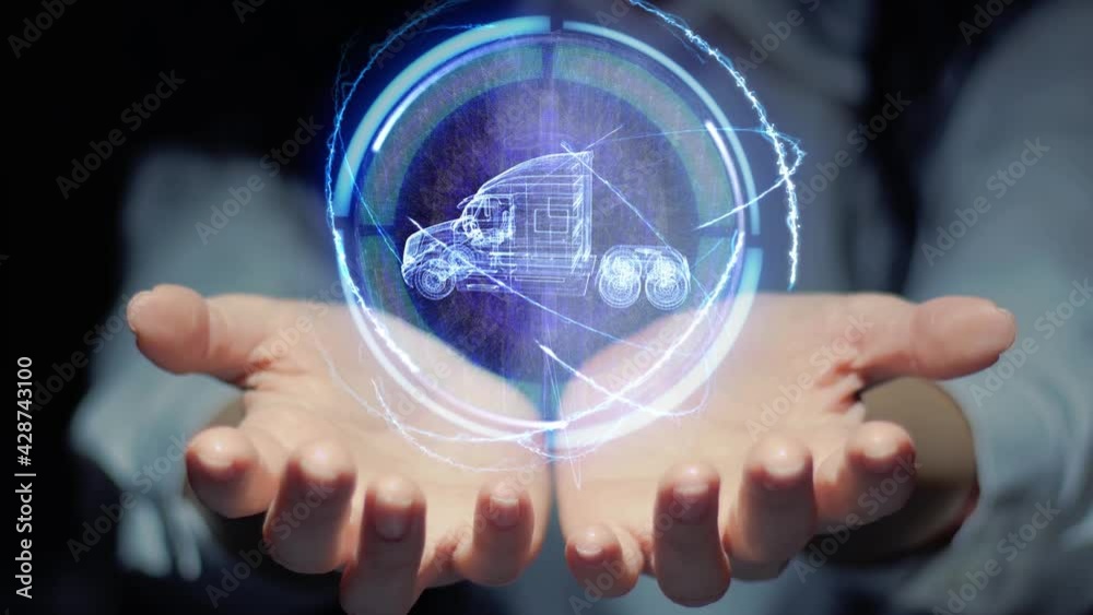 Female hands show a round conceptual hologram with modern American Truck. Unrecognizable woman in ashen white on a black background with future holographic technology Female hands show a round conceptual hologram with modern American Truck. Unrecognizable woman in ashen white on a black background with future holographic technology