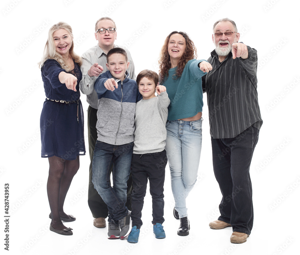 Fototapeta premium in full growth. happy big family pointing somewhere up.