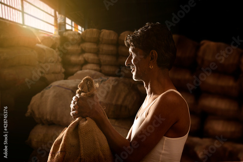 A FARMER WITH HIS PRODUCE AT A MANDI OR WHOLESALE MARKET	 photo