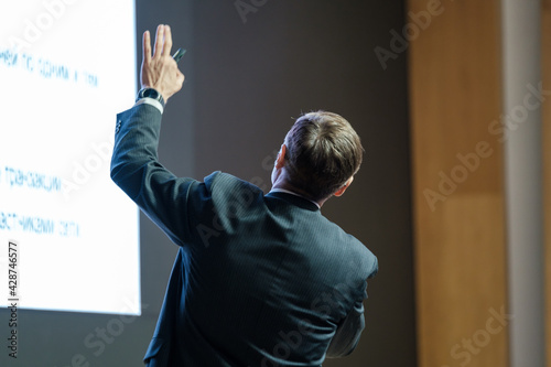 Male presenter speaks to audiences at seminar