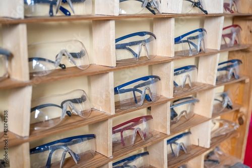 many chemistry working protection glasses shell rowed up in a shool laboratory
