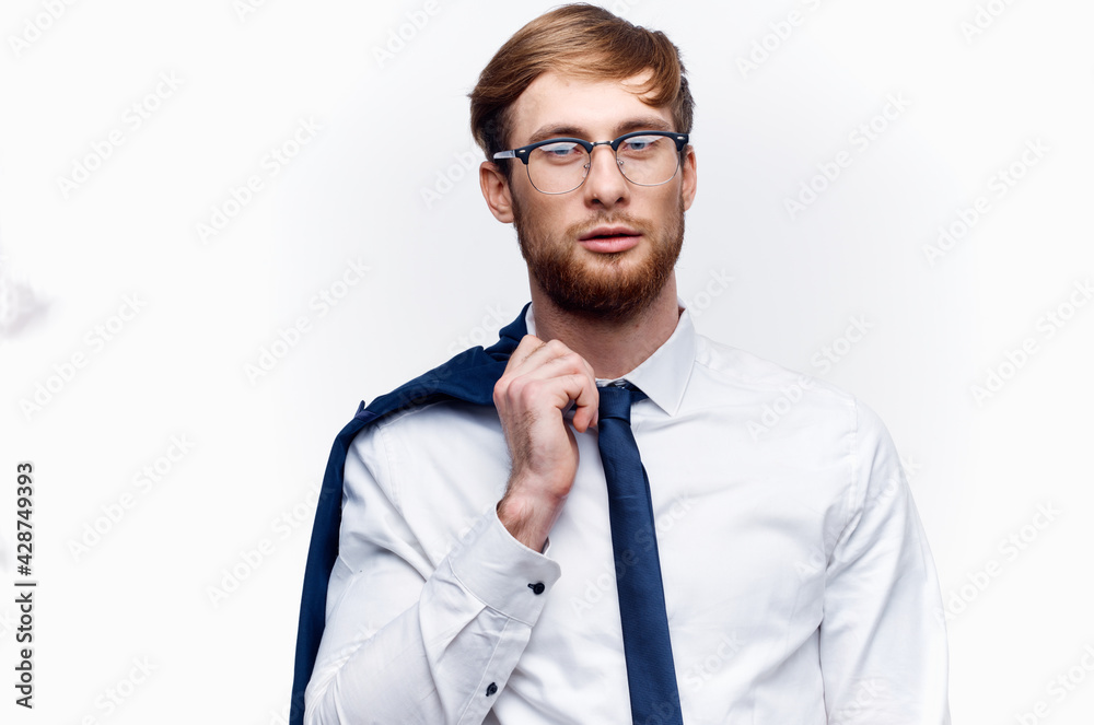 cute businessman in glasses with a jacket on his shoulder and tie shirt model cute businessman in glasses with a jacket on his shoulder and tie shirt model