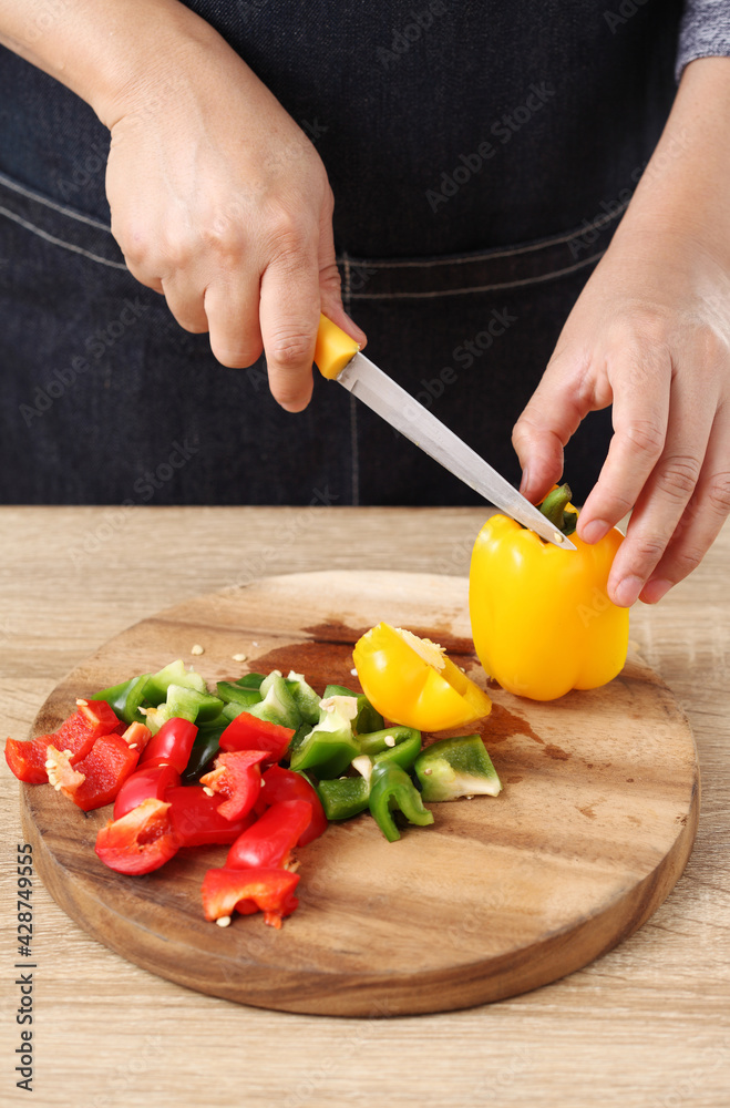 Chef chopped bell pepper on wooden cutting board Chef chopped bell pepper on wooden cutting board