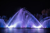Musical multimedia fountain with colorful lights at night. Ukraine, Vinnitsa