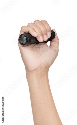 Hand holding black small led flashligt isolated on a white background photo