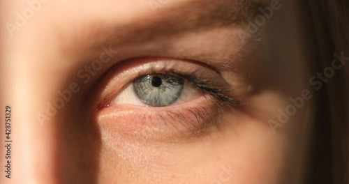 Close-up of young woman grey eye
