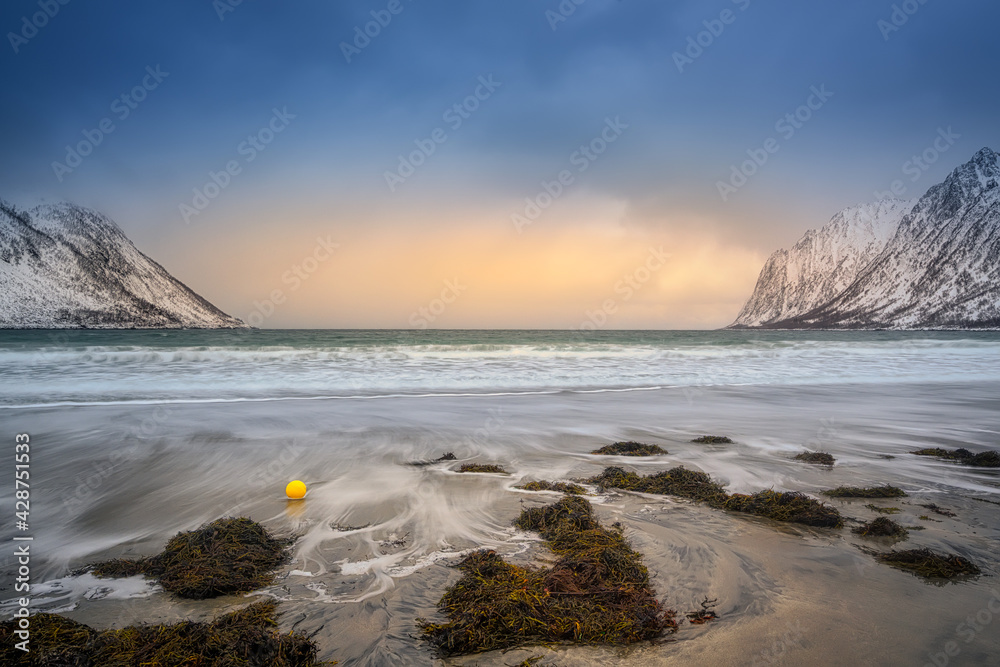 Obraz premium Gulf, bay, Sand beach with a huge surf in Ersfjord in sunrise