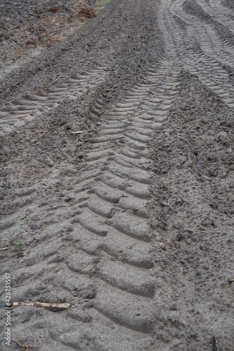 Tractor tire tracks on a plowed field
