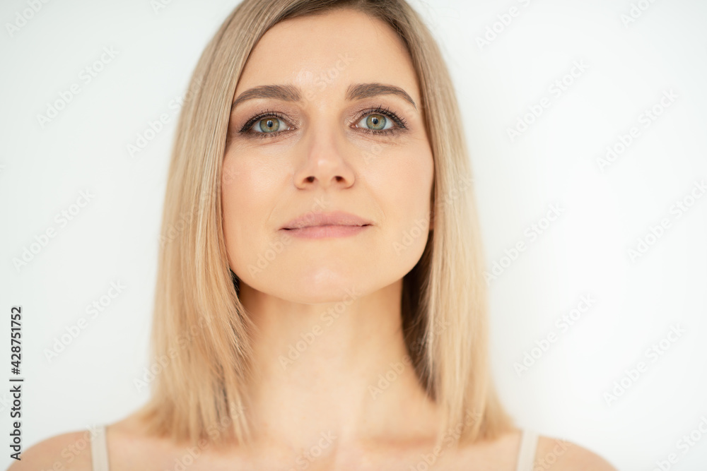 Beautiful calm middle aged woman, natural light. Anti-aging and beauty treatment. Beautiful calm middle aged woman, natural light. Anti-aging and beauty treatment.