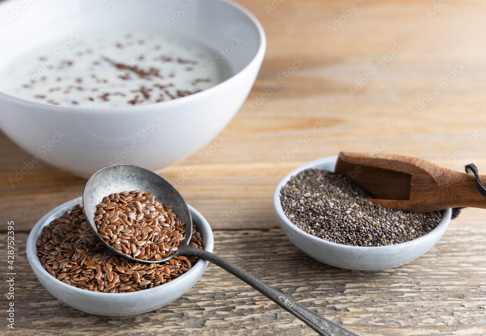 Healthy super foods flax seeds in a bowl mixed with yoghurt ready to eat. These seed are very healthy and can be eaten with a variety of different dishes. Healthy super foods flax seeds in a bowl mixed with yoghurt ready to eat. These seed are very healthy and can be eaten with a variety of different dishes.