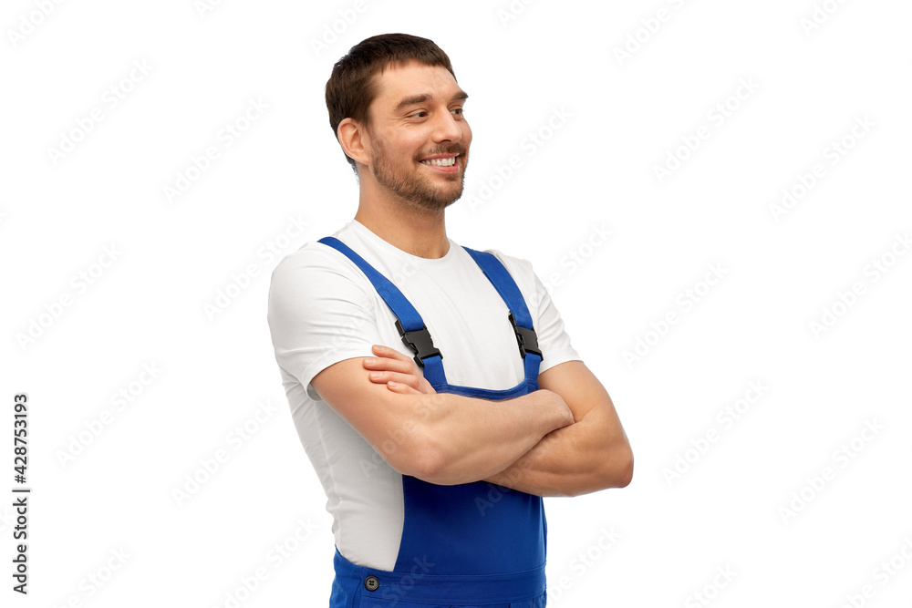profession, construction and building concept - happy smiling male worker or builder in overall over grey background profession, construction and building concept - happy smiling male worker or builder in overall over grey background