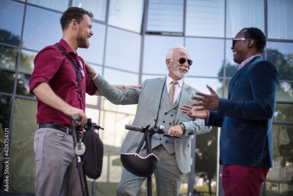 Coworkers. Small Group of business men talking on the street.