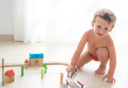 Child playing with toy train