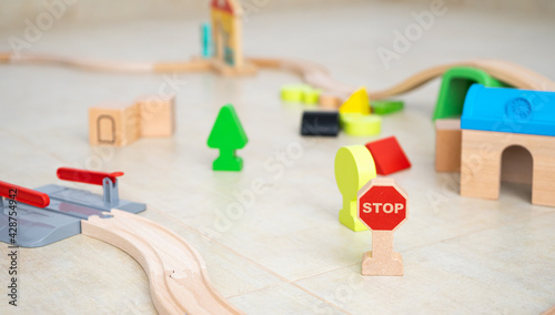 Wooden toys on the floor of a room photo