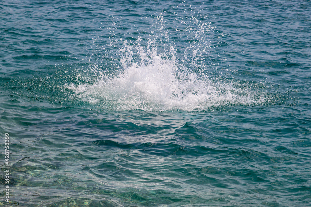 Splash of the water after jumping in the sea Splash of the water after jumping in the sea