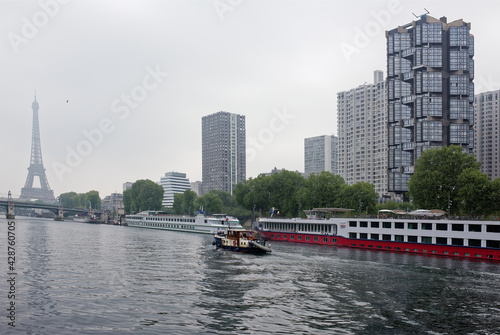   The port of Grenelle and the Swan Island. On the Seine a ship sails photo