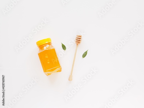 Natural bio honey jar with copy space for branding. Healthy food mockup flat lay