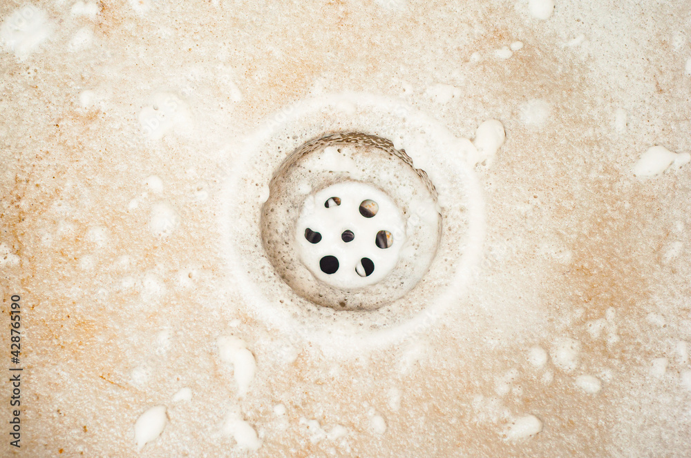 An attempt to wash the fat from the kitchen sink with a foamy detergent An attempt to wash the fat from the kitchen sink with a foamy detergent