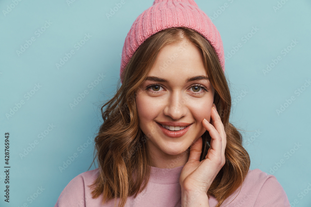 Fototapeta premium Young happy woman smiling and posing at camera