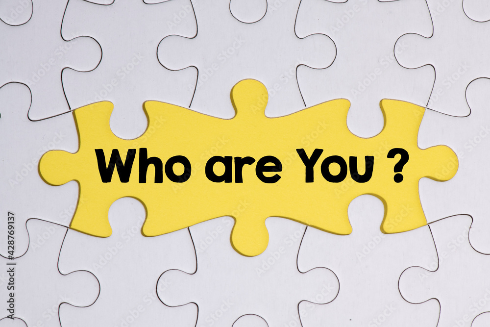 Who are you? Puzzle pieces on yellow background. Who are you? Puzzle pieces on yellow background.