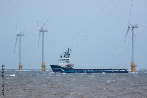 Zero carbon emission electricty production. Supply ship between wind turbines